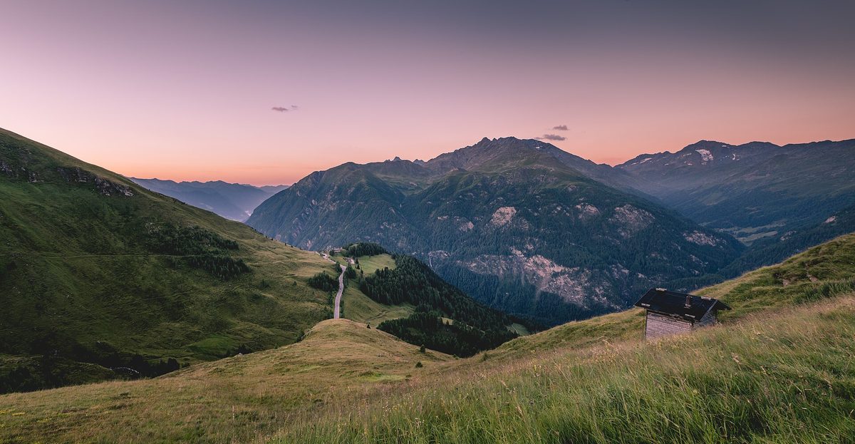 The Grossglockner High Alpine Road winding through the peaks of the Hohe Tauern at dusk