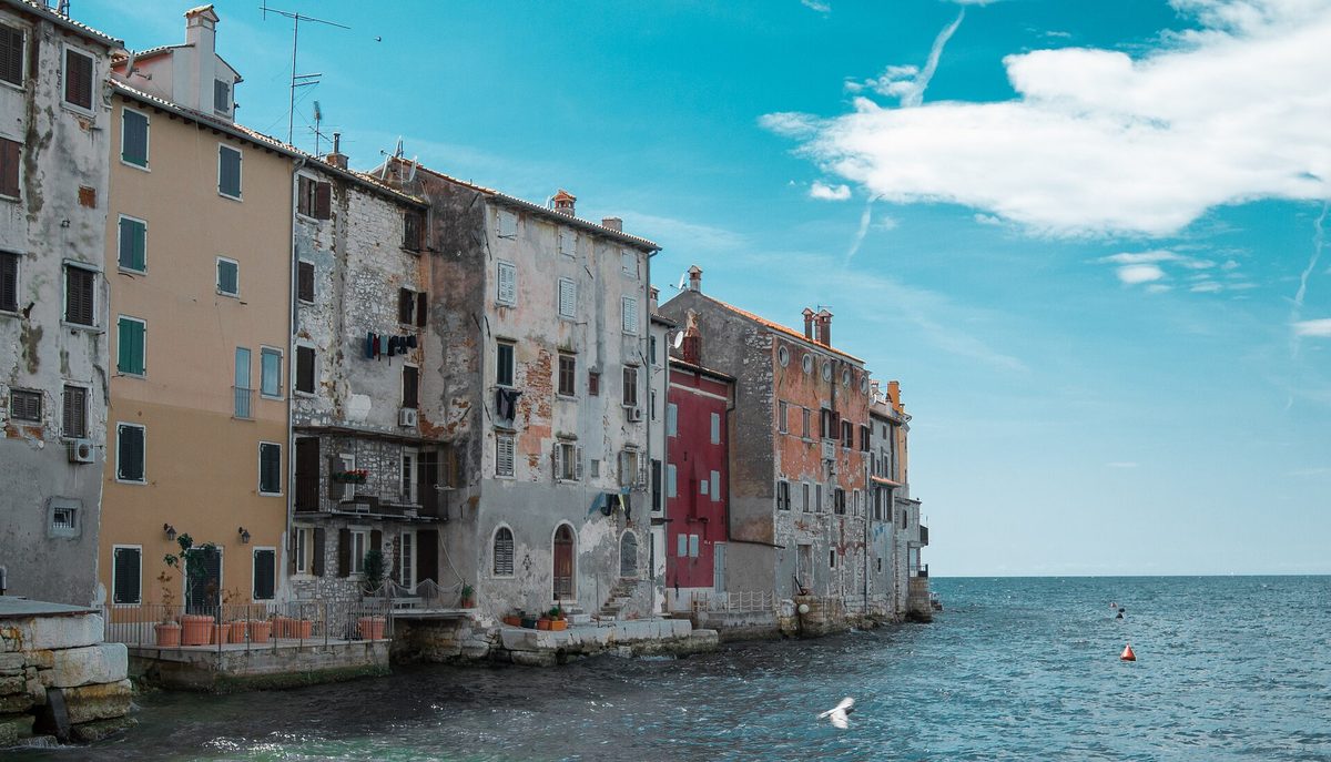 Rovinj old town houses rising from the Adriatic, Istria, Croatia