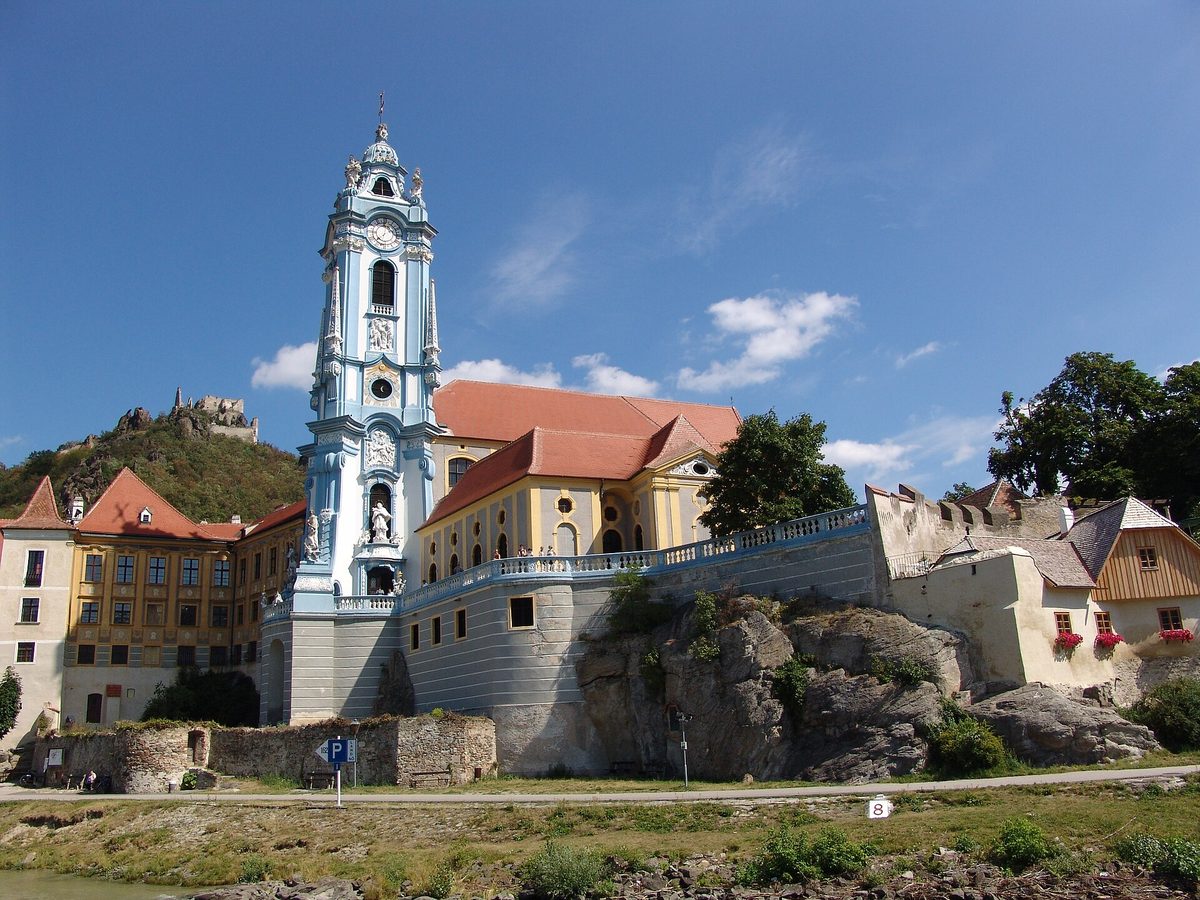 Terraced vineyards and the blue church tower of Duernstein in the Wachau Valley on the Danube