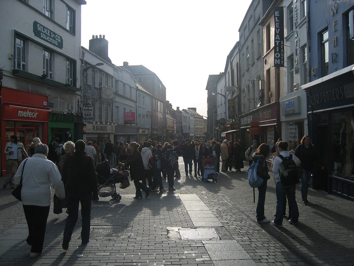 Colourful shopfronts and buskers in Galway's Latin Quarter, Ireland