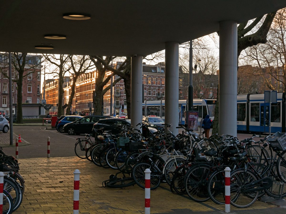 Bicycles parked along a canal bridge in Amsterdam, the Netherlands