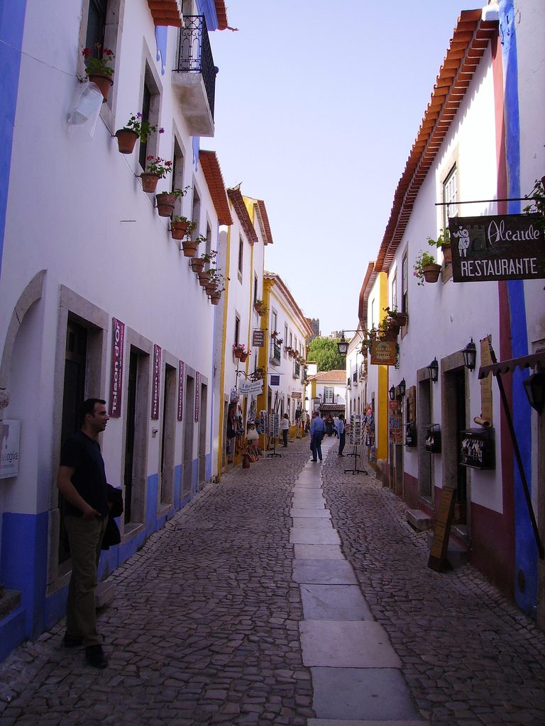 Whitewashed houses and the medieval castle walls of Obidos, central Portugal