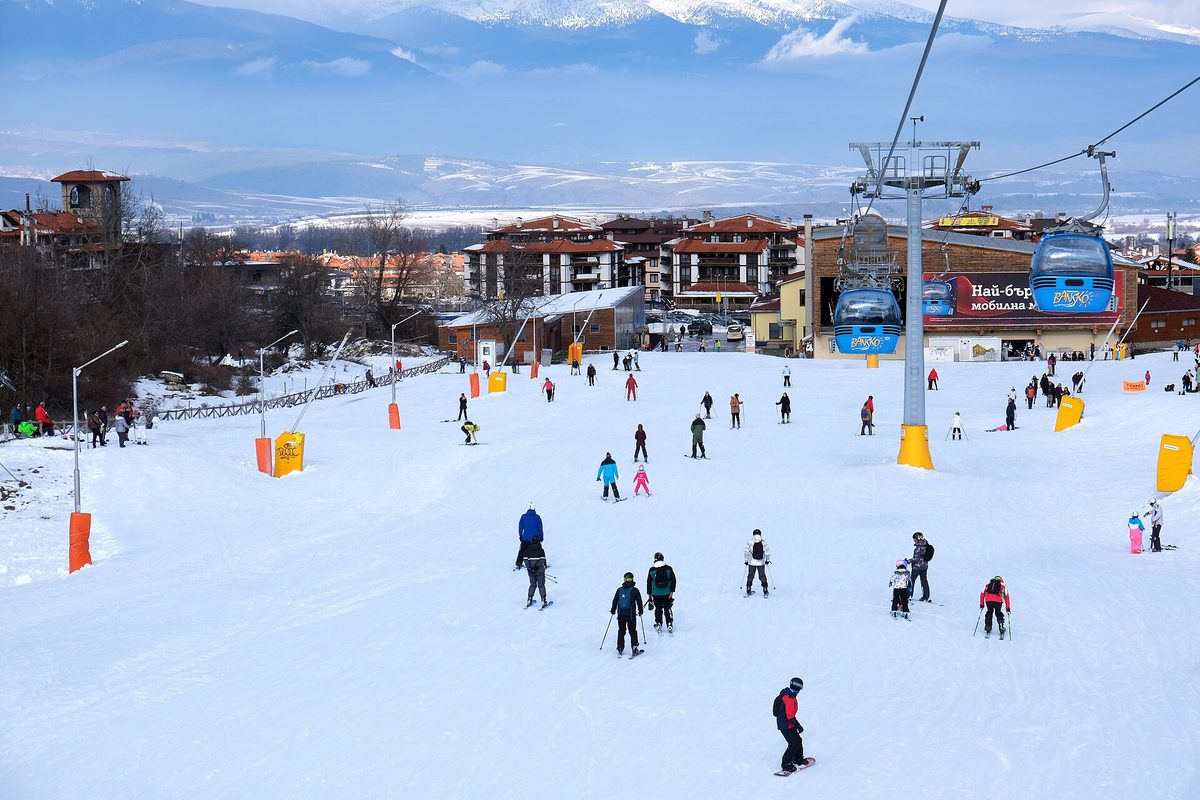 Snowy pistes and the Pirin mountains above Bansko, Bulgaria, one of the best-value places for skiing in Europe
