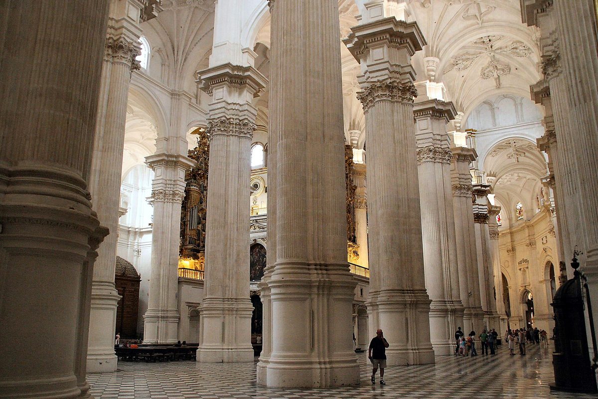 White Renaissance columns and vaulting inside Granada Cathedral