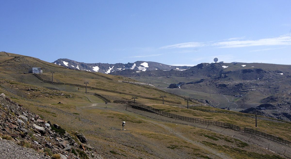 The Sierra Nevada ski area above Granada in summer, with lift lines and patches of late snow