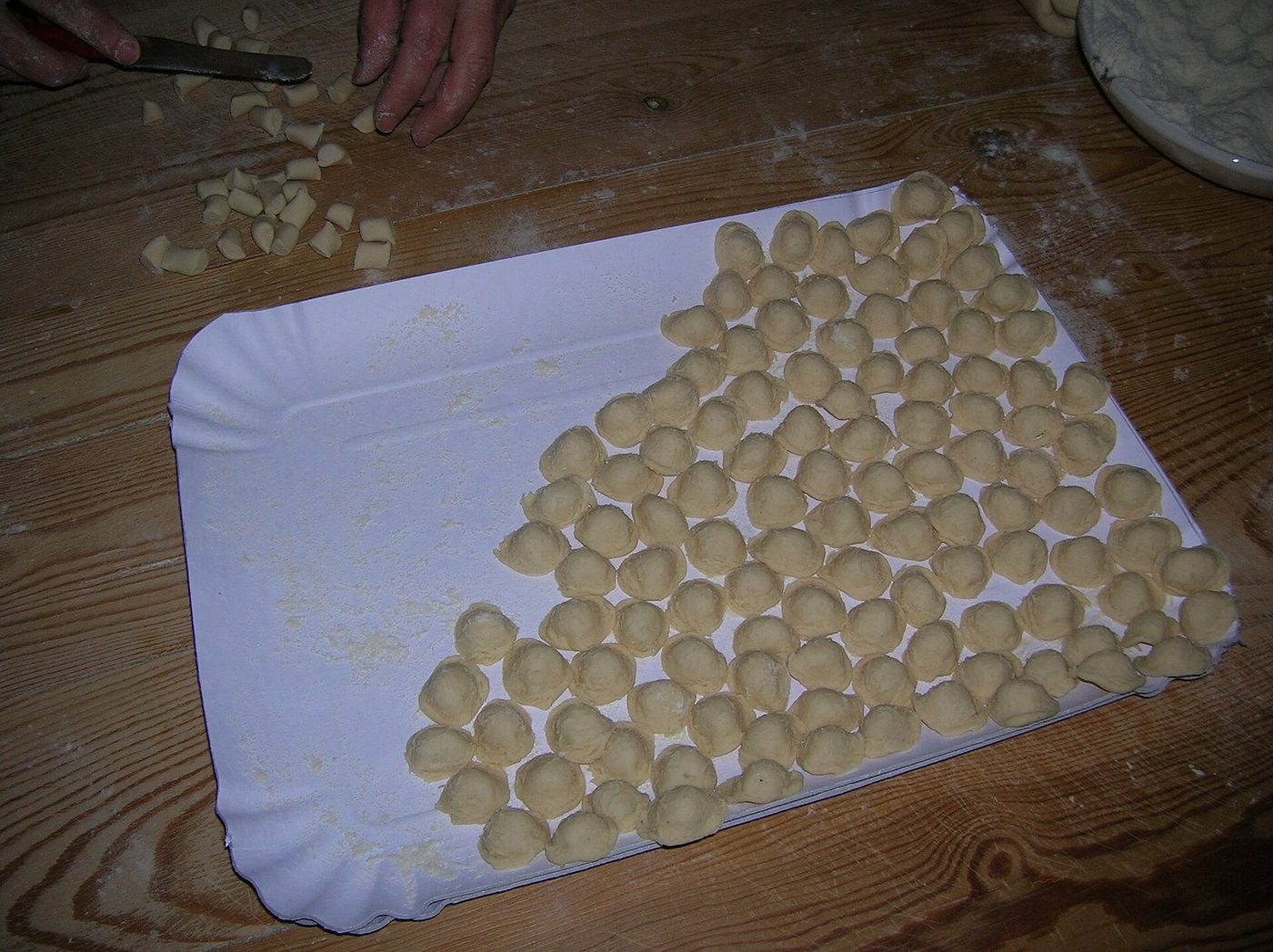 Freshly shaped orecchiette drying on a tray, the pasta of Puglia