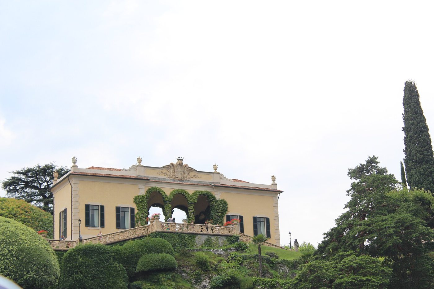 The loggia and clipped hedges of Villa del Balbianello on its promontory at Lenno