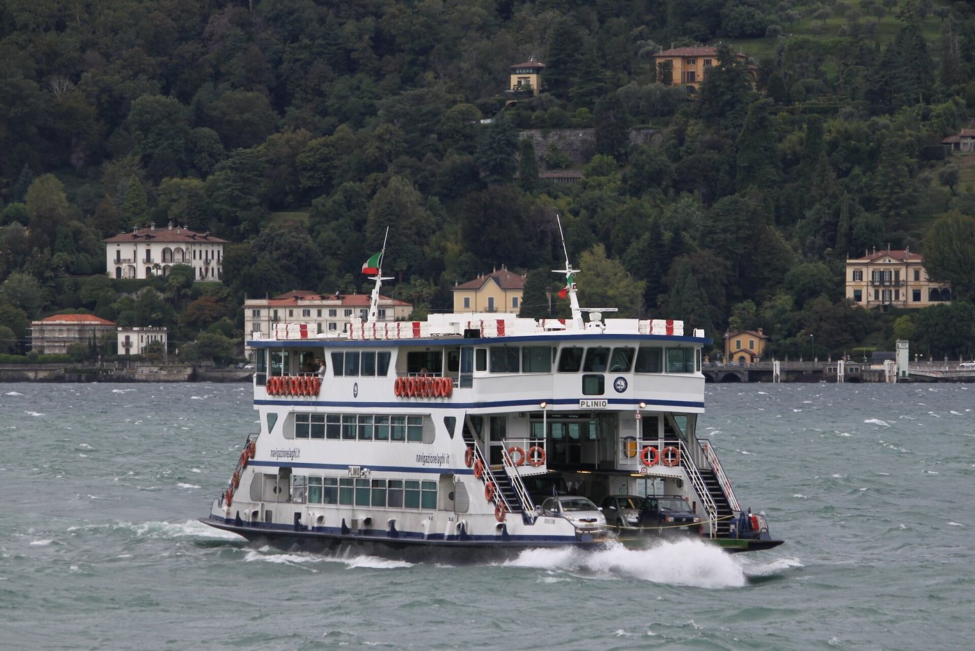 A Navigazione Lago di Como car ferry underway with vehicles on its deck