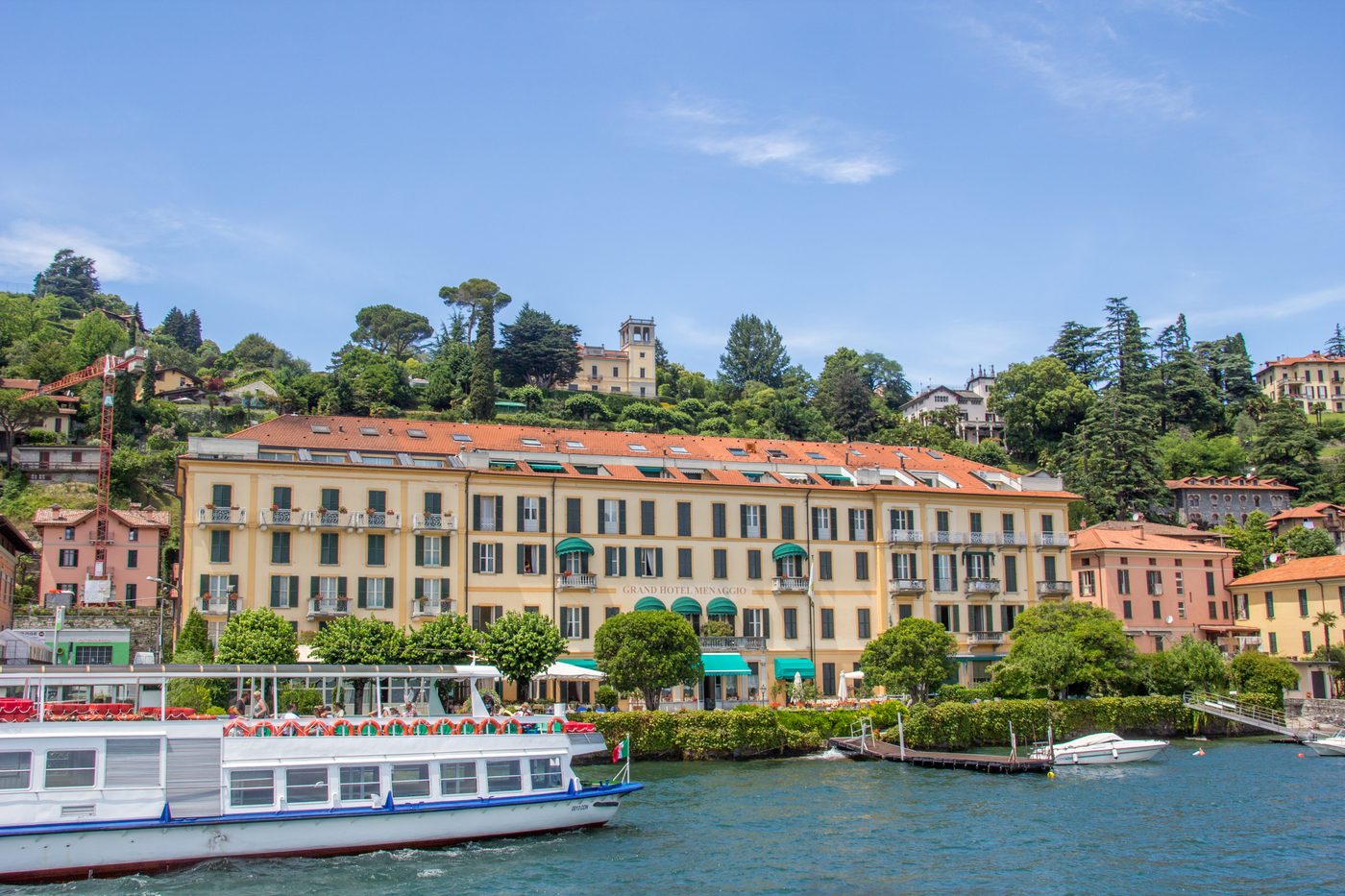 A passenger ferry moored at the lakefront in Menaggio on the western shore of Lake Como