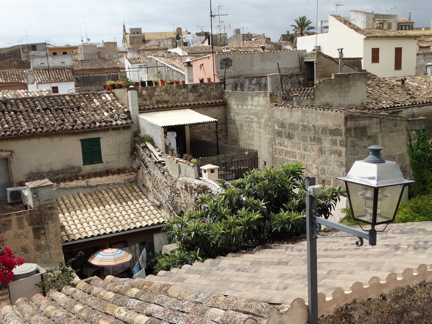 Rooftops of the old town of Alcudia seen from its medieval walls, northern Mallorca