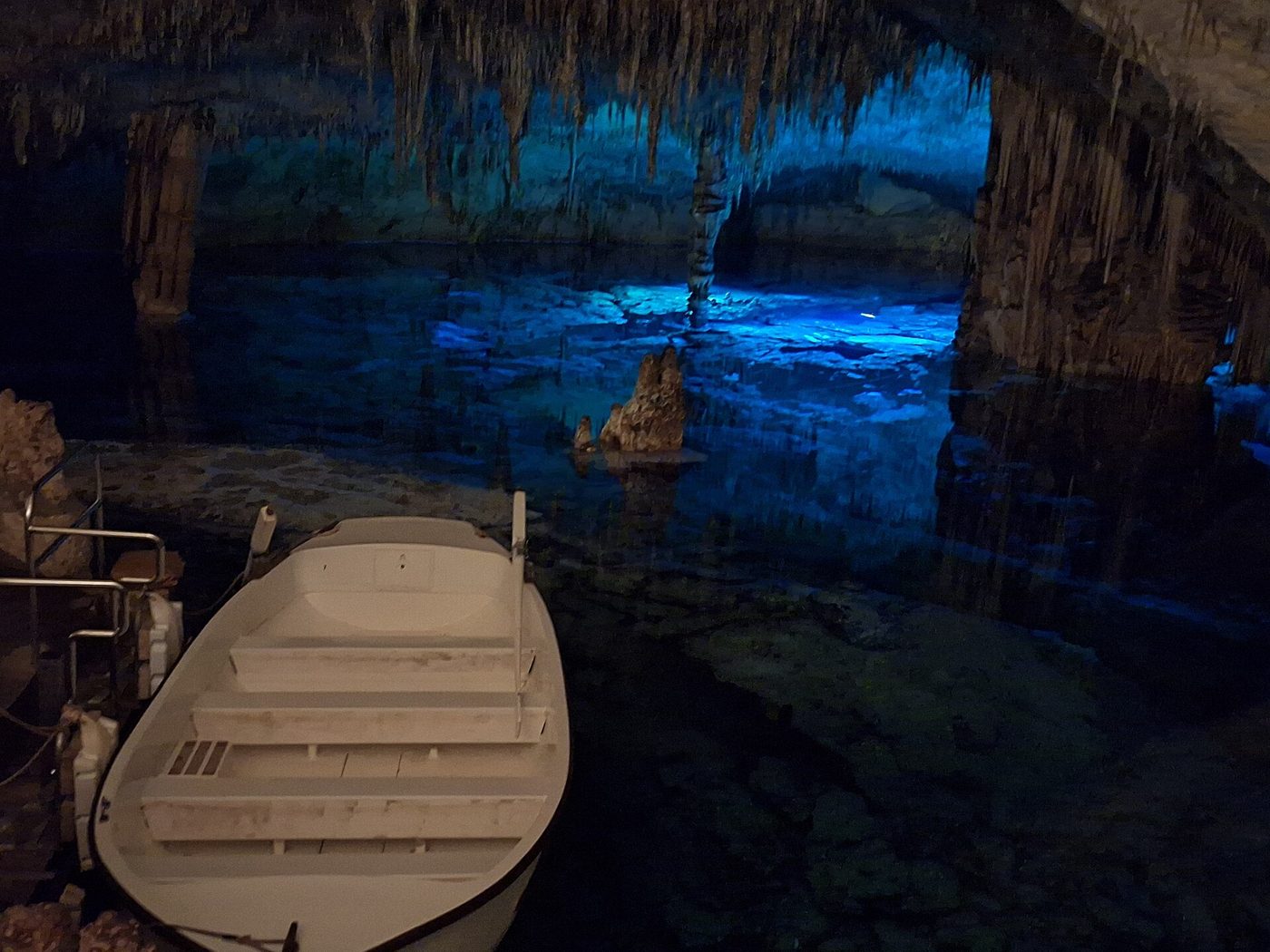 A boat on Lake Martel inside the Coves del Drach near Porto Cristo, Mallorca