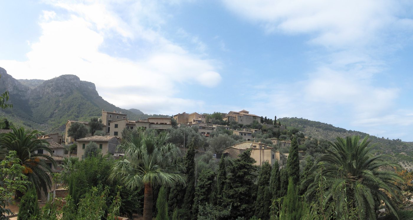 The hillside village of Deia between the Tramuntana mountains and the sea, Mallorca