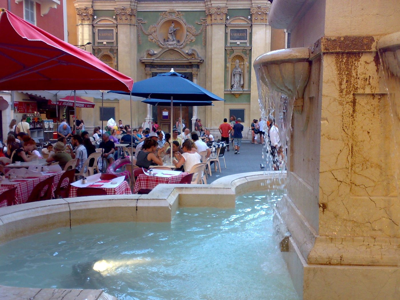 The fountain and cafe terraces on Place Rossetti in Vieux Nice