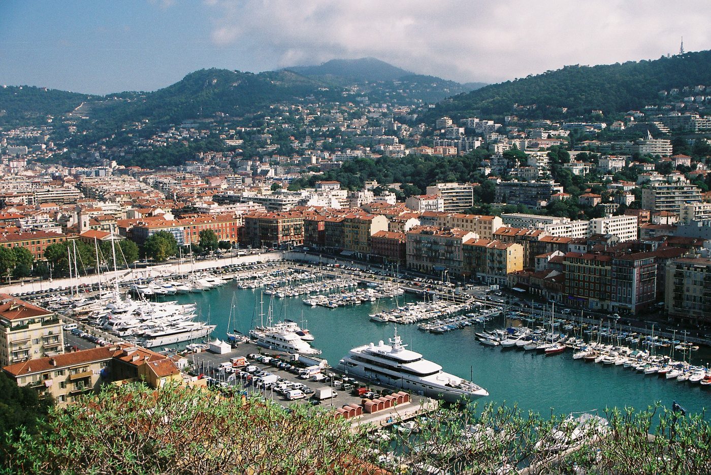 Yachts moored in Port Lympia below the hills east of Nice