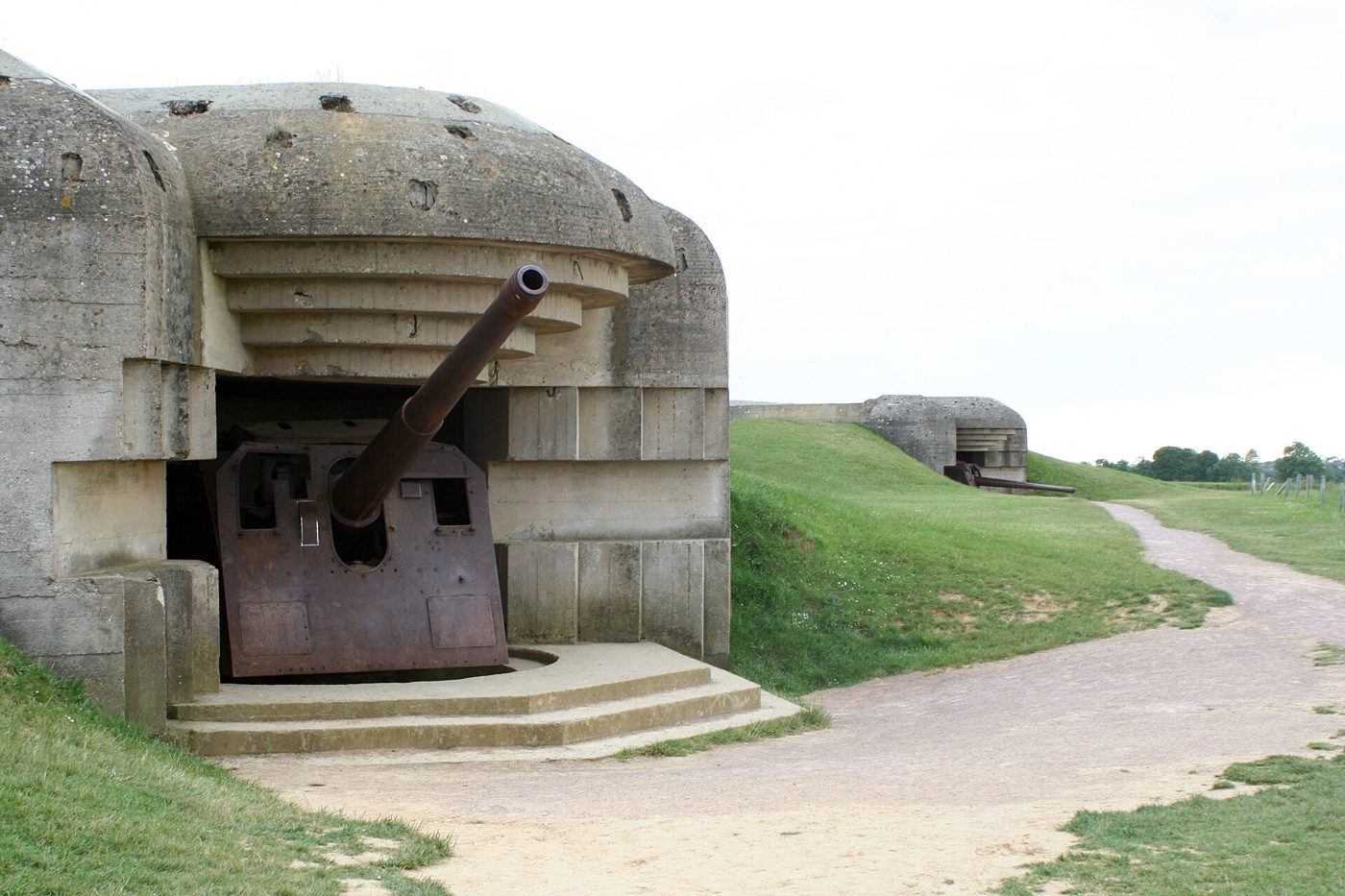 A German naval gun still in its casemate at the Longues-sur-Mer battery
