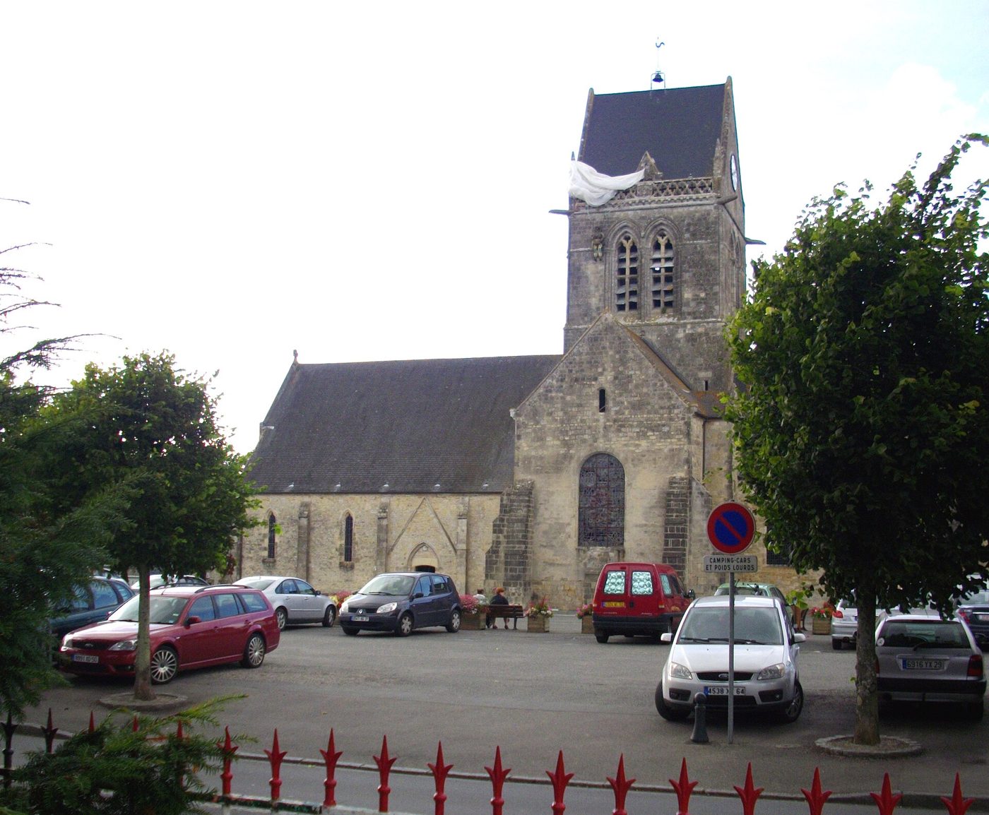 The dummy paratrooper hanging from the church tower at Sainte-Mere-Eglise