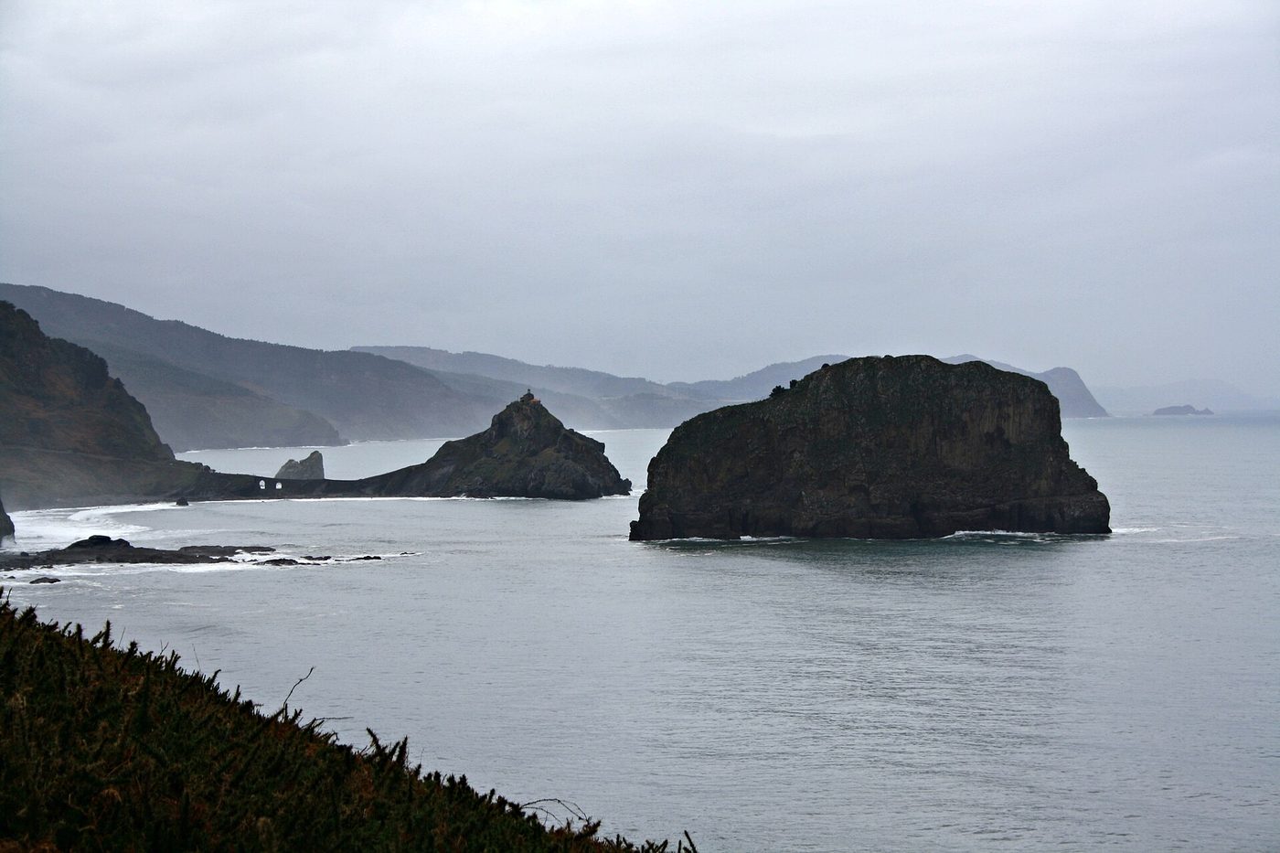 The stone bridge and rock of San Juan de Gaztelugatxe on the Bizkaia coast