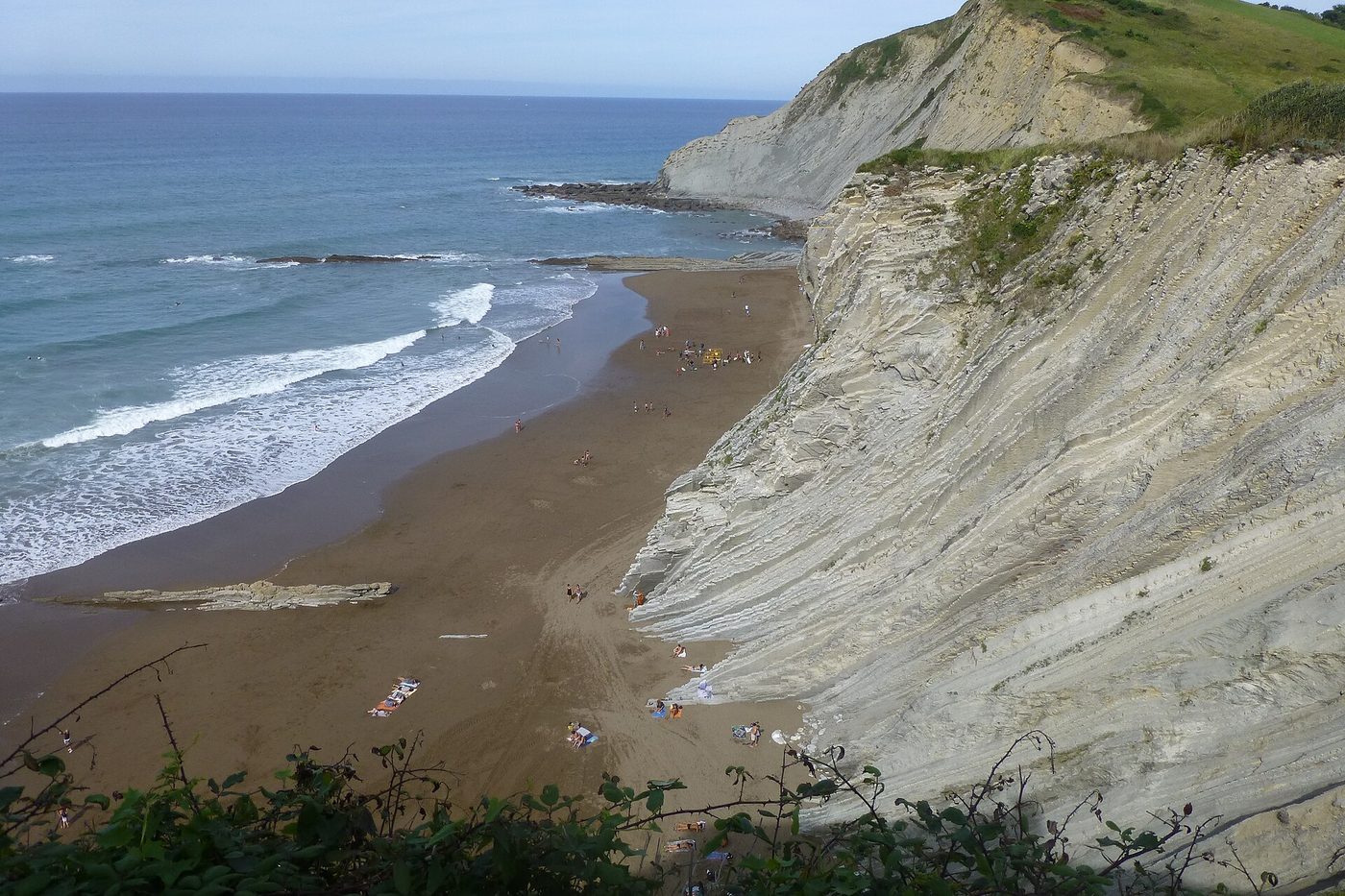 The striped flysch cliffs at Itzurun beach in Zumaia, Basque Country