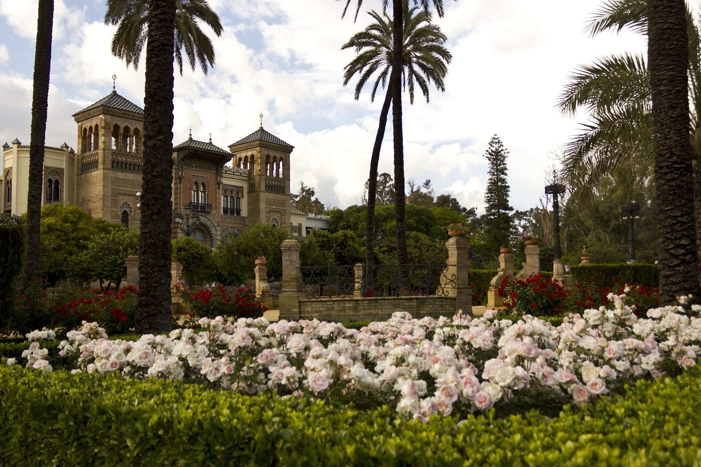 Flowerbeds and palms in the Parque de María Luisa in Seville