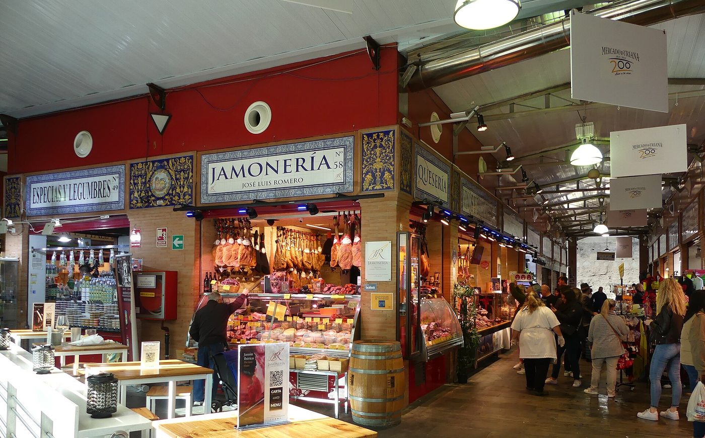 Stalls and bar counters inside the Mercado de Triana in Seville