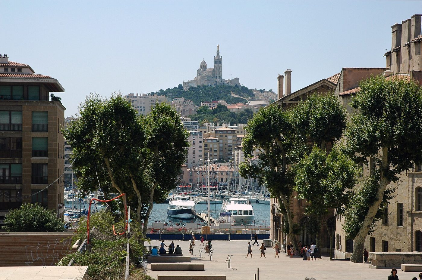 Fishing boats in the Vieux-Port of Marseille with Notre-Dame-de-la-Garde on the hill above