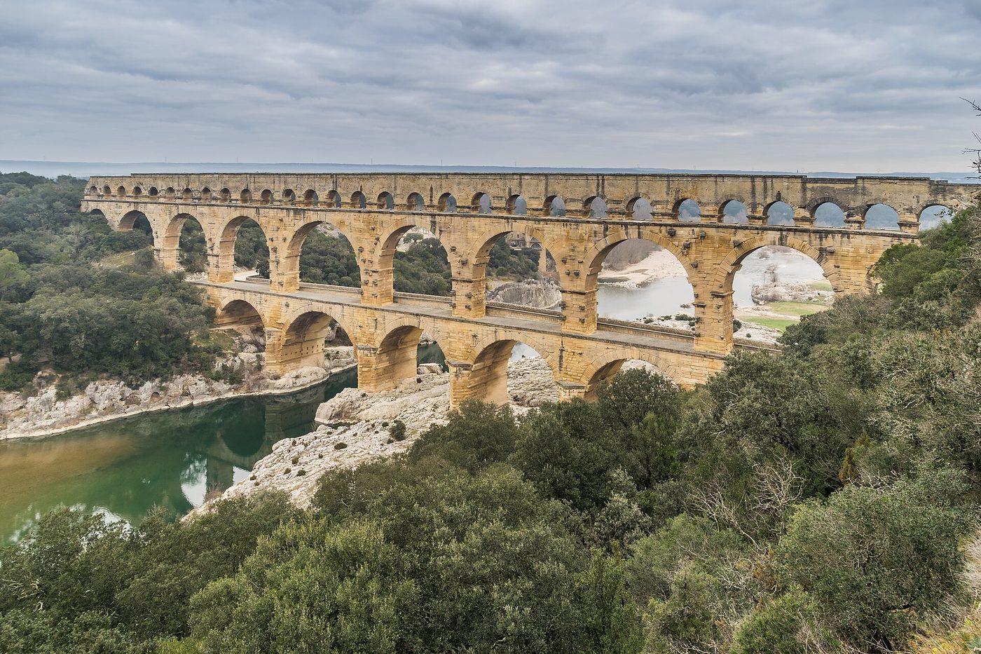 The three tiers of the Roman Pont du Gard aqueduct spanning the Gardon river