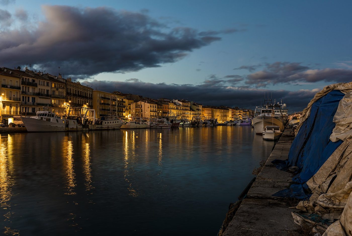 Boats along a canal in Sete on the Languedoc coast at dusk