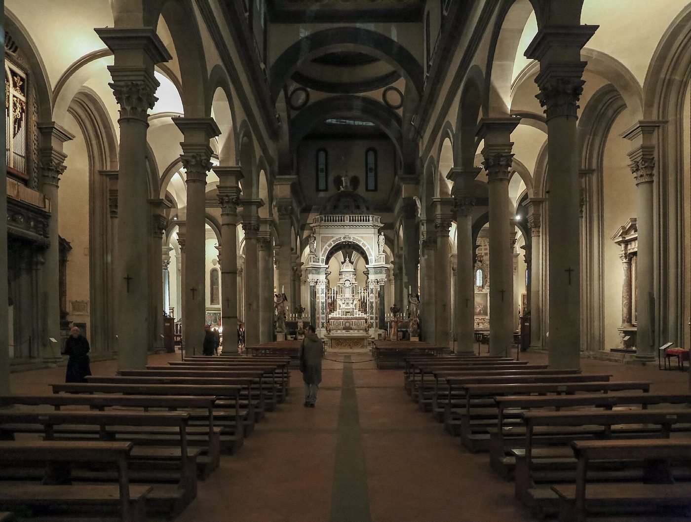 The grey stone colonnade of Brunelleschi's Santo Spirito in the Oltrarno district of Florence