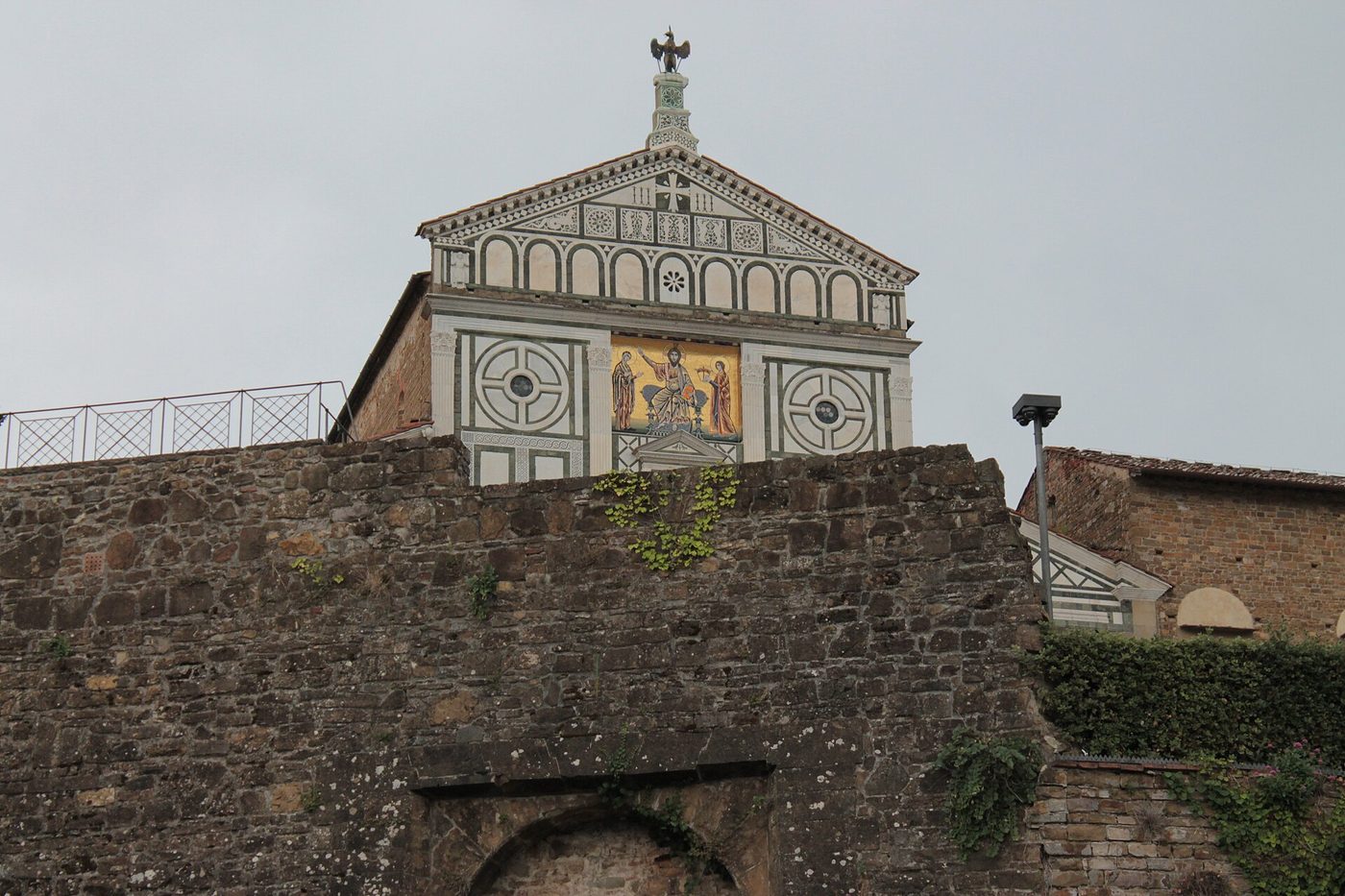 The mosaic gable and marble facade of San Miniato al Monte on the hill above Florence
