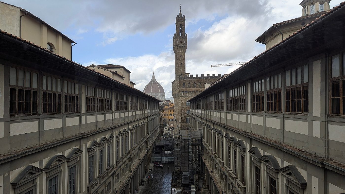 The Uffizi courtyard in Florence looking toward the tower of Palazzo Vecchio and the cathedral dome
