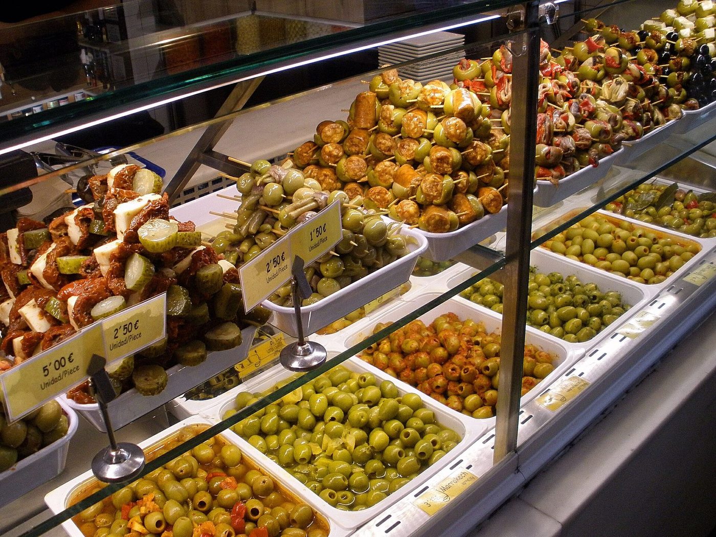 Olive and pincho stalls inside the Mercado de San Miguel in Madrid