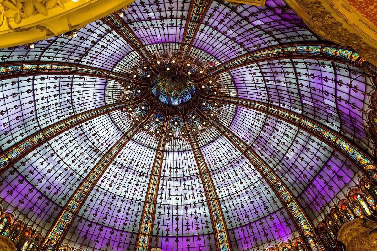 The Art Nouveau stained-glass dome above the shop floor of Galeries Lafayette Haussmann in Paris