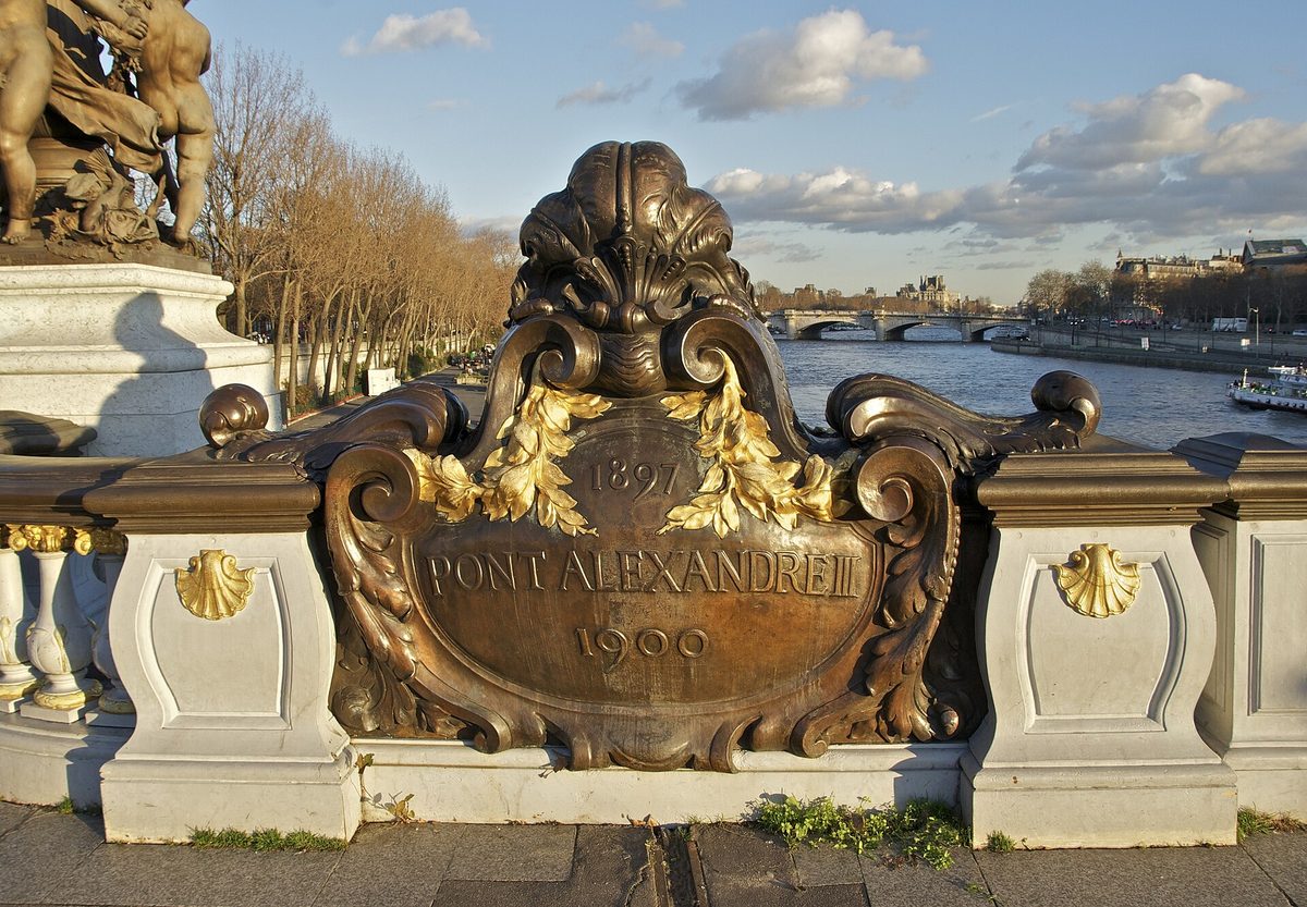 The bronze and gilt cartouche on the Pont Alexandre III above the Seine in Paris