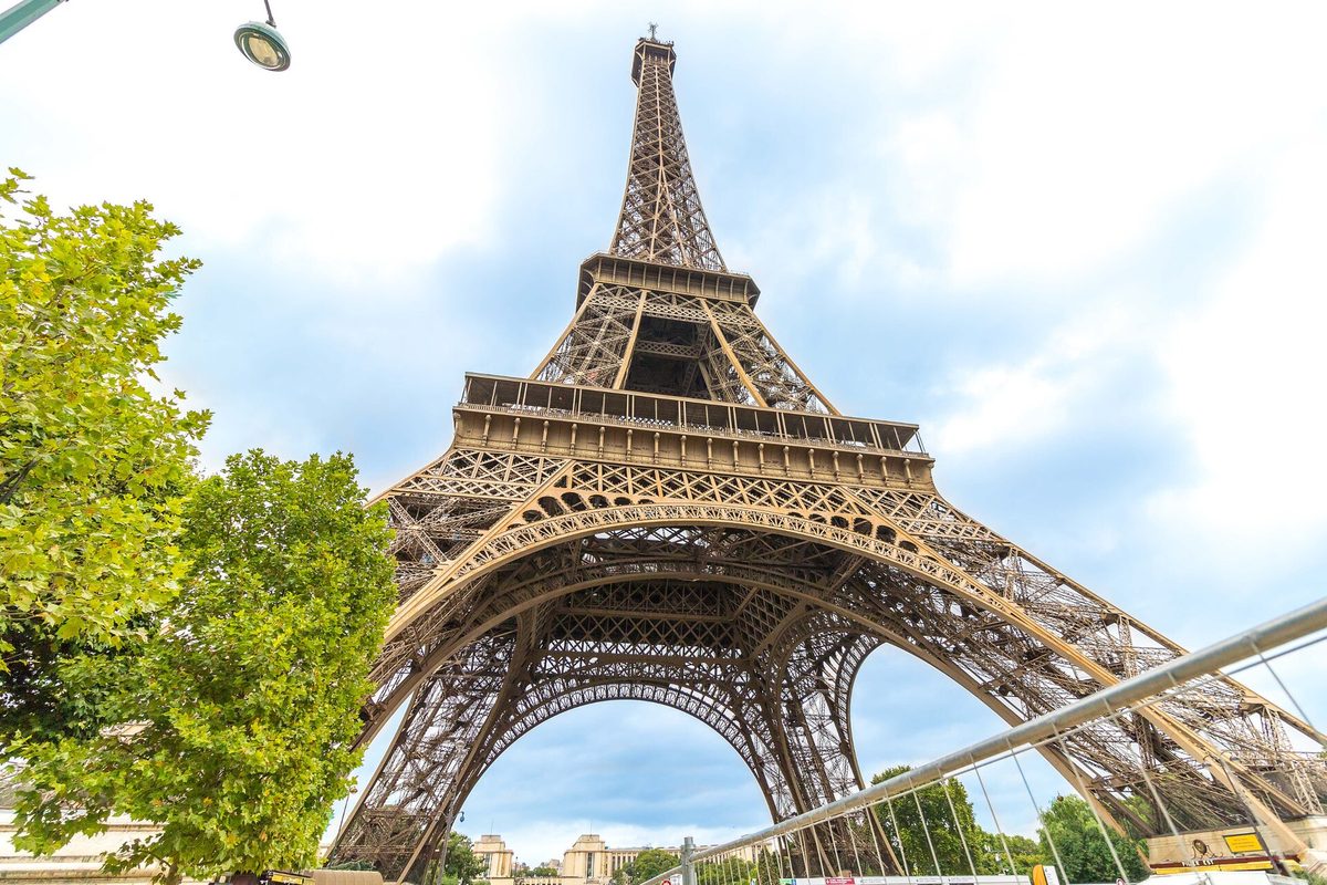 The Eiffel Tower seen looking up from the riverside walk in Paris