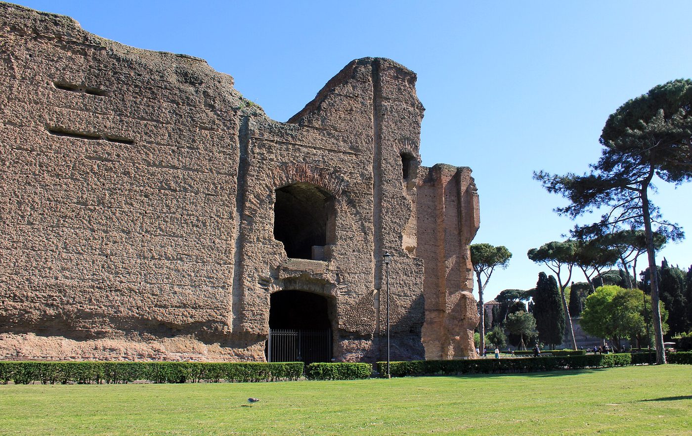 The towering brick walls and umbrella pines of the Baths of Caracalla in Rome