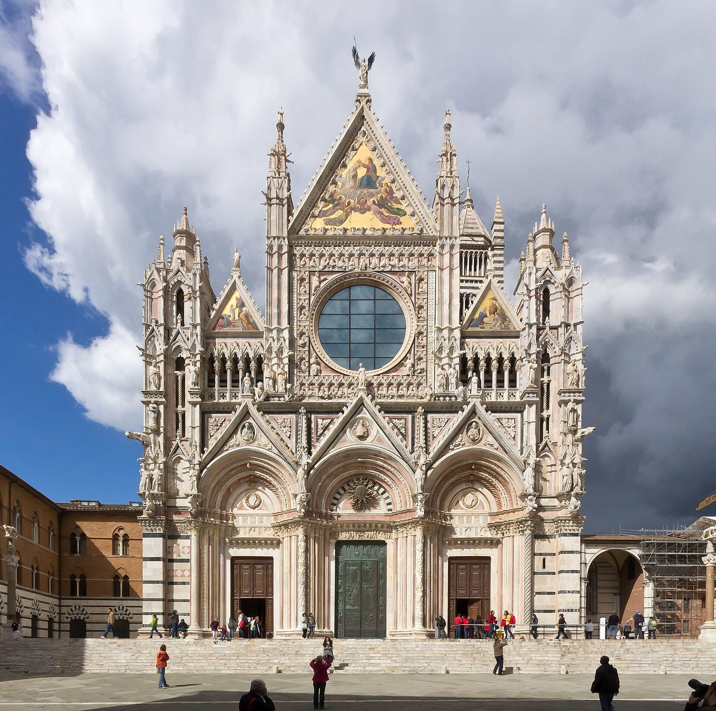 The striped marble facade of Siena Cathedral in Tuscany